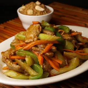 Szechuan Beef (tender slices of beef combined with celery, carrots, and green peppers in our Szechuan sauce)