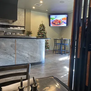 a view of a kitchen and dining area