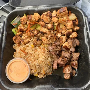 Cajun chicken, steak and fried rice.
