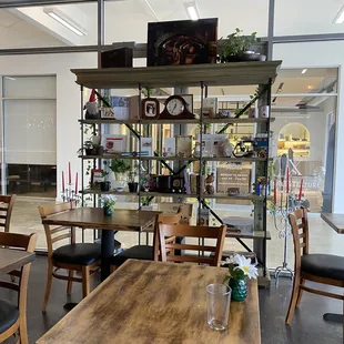 a dining area with tables and chairs