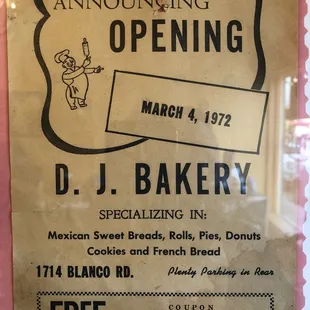 a sign for an upcoming opening