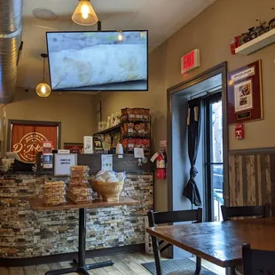 a large flat screen tv above the counter