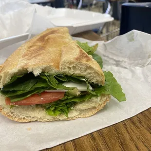 Vegetable torta with the tiniest slice of cheese peeking out.