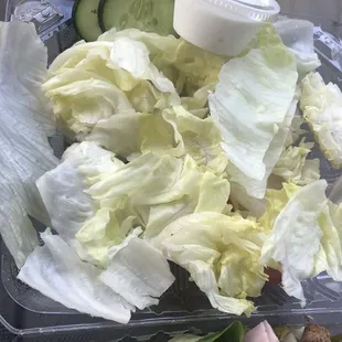 Other side of salad lid Filled with yellow &amp; white lettuce