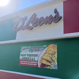 Near front door D'Leon's sign and Taco Tuesday 99 cents special sign