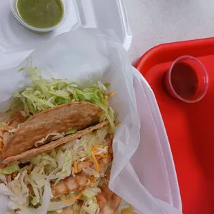 4 tacos, avocado salsa, and red salsa