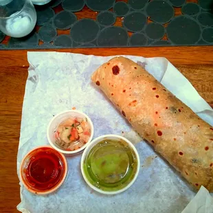 a burrito and condiments