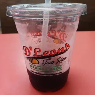 a plastic cup with a straw