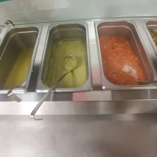 Salsa bar. The pico de gallo is foaming and bubbling... not sure if I'd trust it.