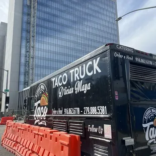 a taco truck parked in front of a building