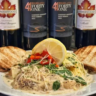 Chicken Piccata - angel hair pasta with a delightful lemon, wine cream sauce, capers, spinach, and artichokes.