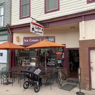 a bicycle parked in front of a coffee shop