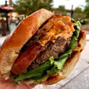 Southern Classic Burger - Signature Blend topped with a Fried Green Tomato, Pimento Cheese, Lettuce, and Bacon