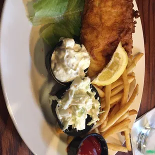 Walleye dinner with fries, coleslaw, and tartar sauce. Delicious!