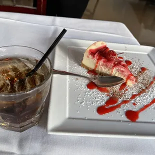 a slice of cheesecake and a drink