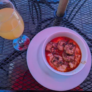 Shrimp and grits, peach mimosa.