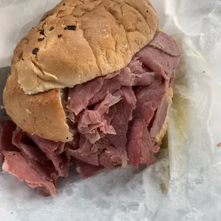 Corn beef on onion roll with mustard