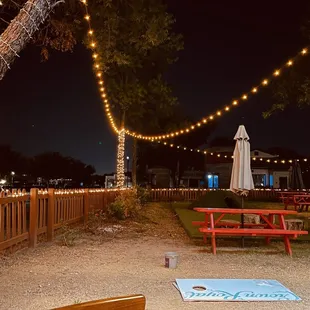 a picnic area with tables and umbrellas