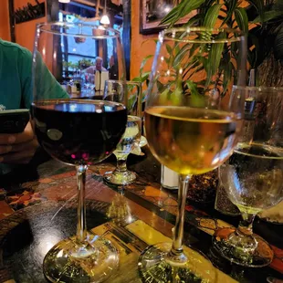 two glasses of wine on a table