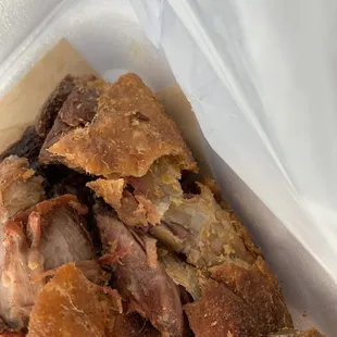 a piece of meat in a plastic container