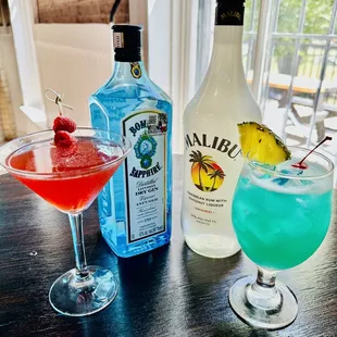 two cocktails and a bottle of malibu