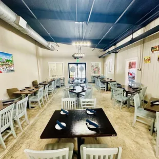 a dining room with tables and chairs