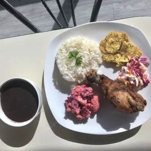 White Rice with bean purée, Haitian fried chicken, pikliz, fried plantain, beet salad