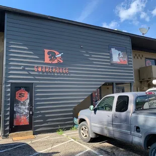 a truck parked in front of the building