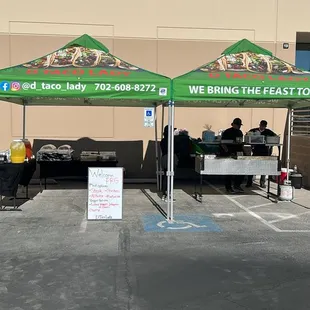 a tent set up in a parking lot