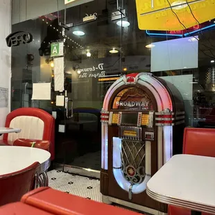 a jukebox in the background