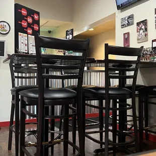 This is inside, behind that table is the carry out counter.  There are multiple tv screens in the restaurant.