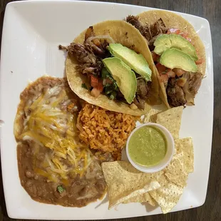 Beef tacos in corn tortillas and with refrito beans and rice