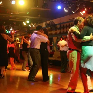 people dancing in a dance hall