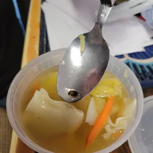 a spoon in a bowl of soup