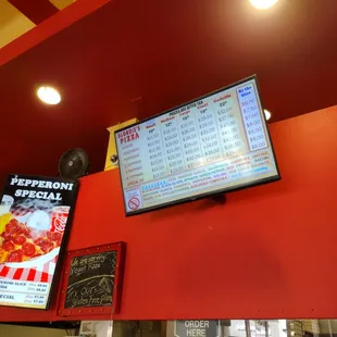 a menu on a red wall
