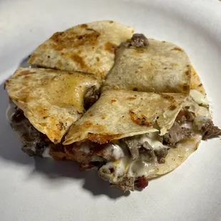 Steak quesadilla with freshly grated cheese