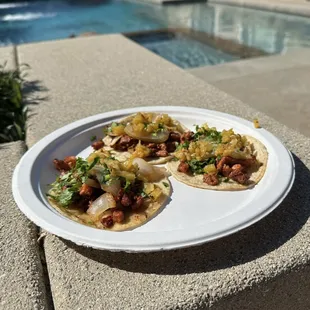 Adobada tacos topped with grilled pineapple salsa