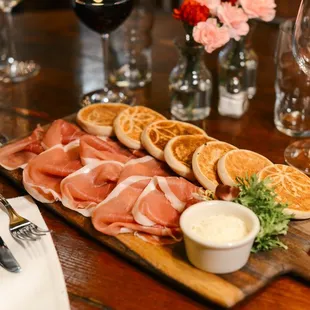 Fresh baked "tigelle"  buns with Parma prosciutto