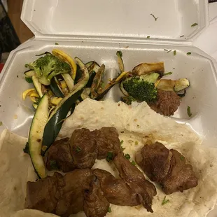 a meal in a styrofoam container