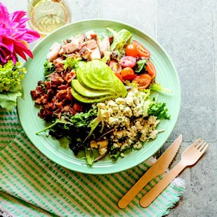 a plate of food and a glass of wine