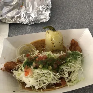 Baja fish taco with salted chili pepper and super delicious side of salsa!