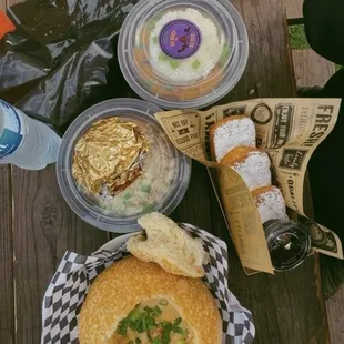 Cheesy crawfish and shrimp bowl, crawfish étouffée, red beans and rice and beignets