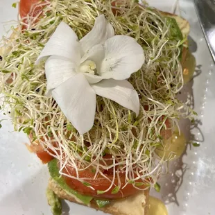  sandwich with sprouts and a flower