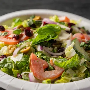 a salad in a paper plate