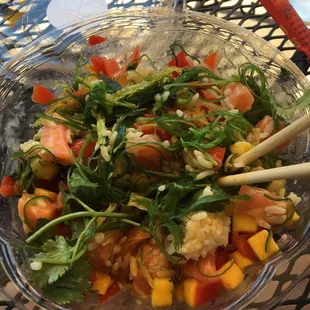 Salmon coconut curry poke bowl with seaweed.