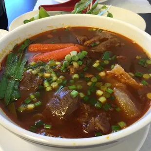 Beef stew. Yummy too bad they don&apos;t have bread today. ( sigh)
