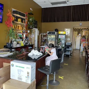 a woman sitting at a bar