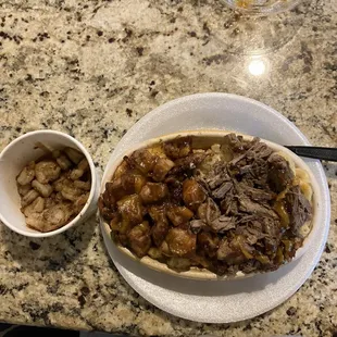 This is the macaroni cheese bowl with braised beef,honey jerk chicken with a side of grilled shrimp