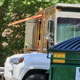 a dumpster and a truck