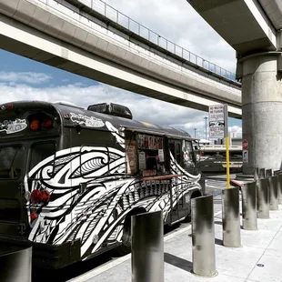 a black bus with a tribal design